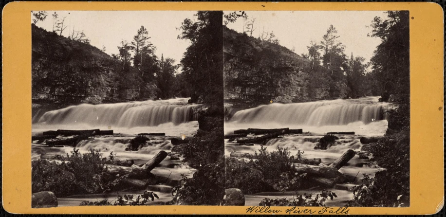 an old pograph of the side of a waterfall