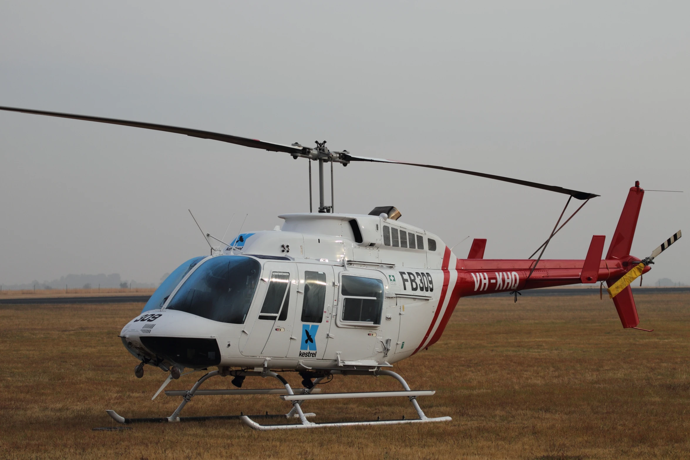 a large white and blue helicopter with people in it