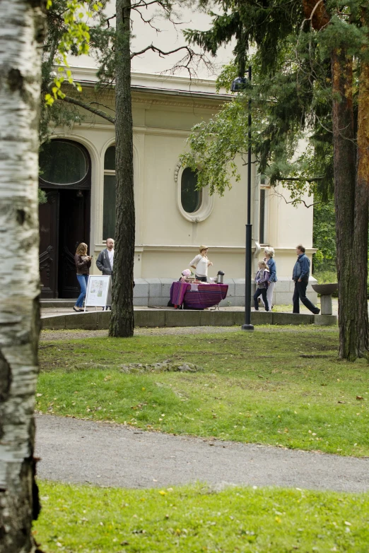 people sitting on benches in a park