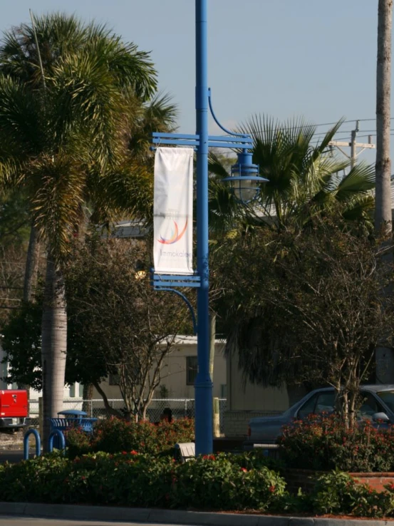 a street lamp with an outdoor banner in the foreground