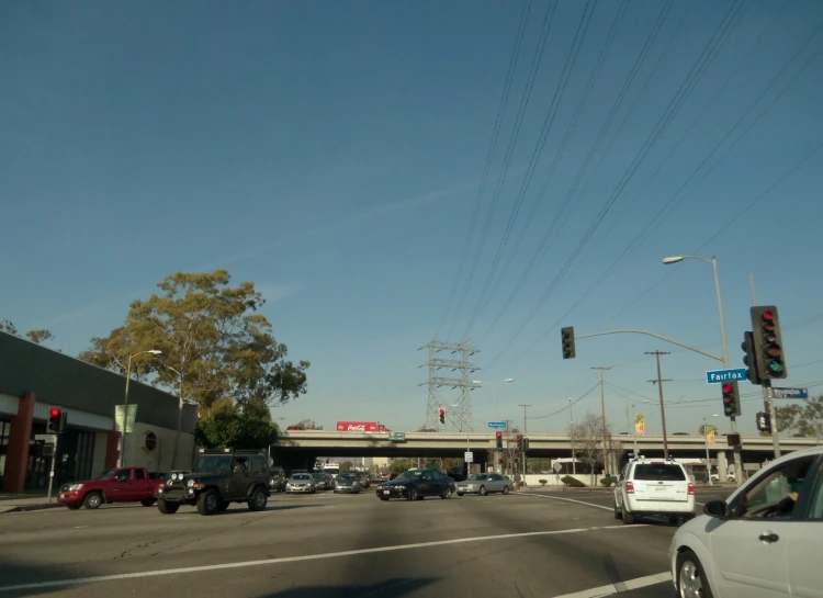 a street filled with lots of cars and traffic lights