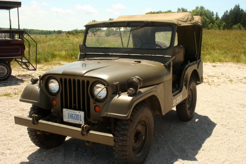 an older vehicle that has been restored to look like it is parked in the dirt