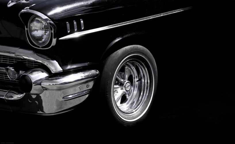 an older style car parked in the dark