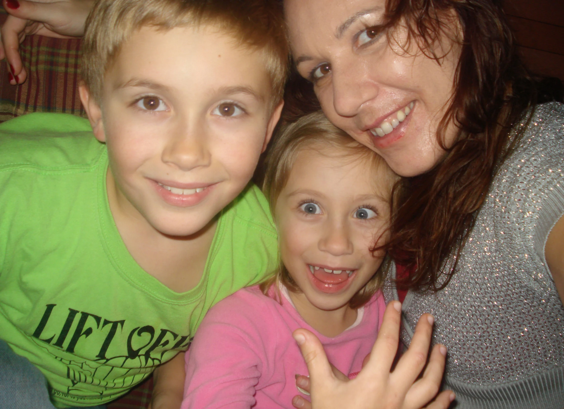 two women and a child are posing for a po