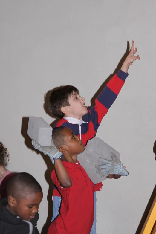 two small boys who are playing together