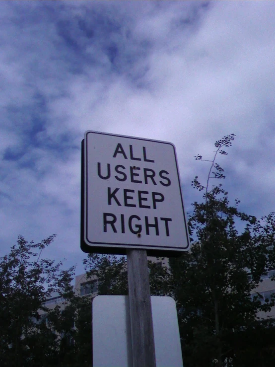 a street sign is shown against the blue sky