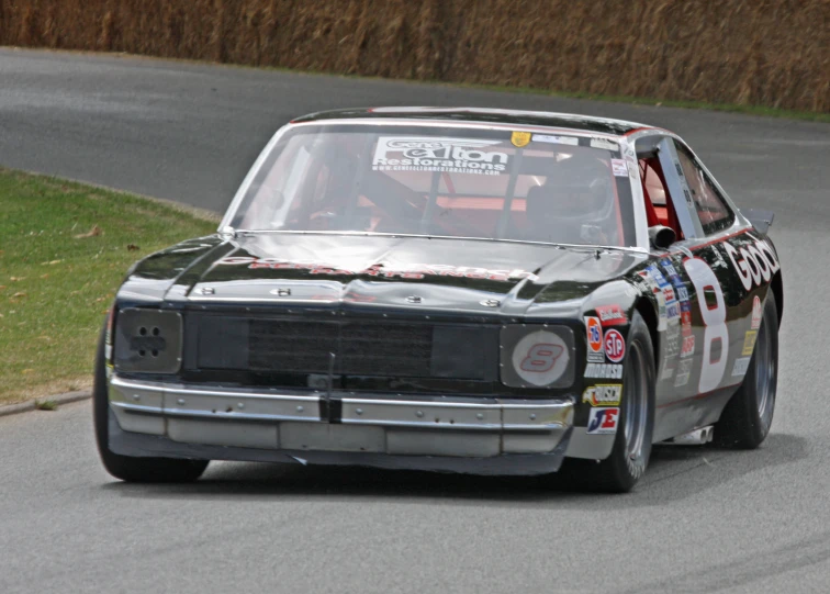 an automobile in motion driving on the road