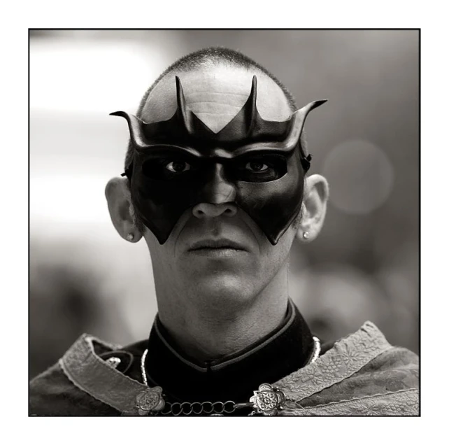 a man in costume with spiked ears and a nose mask