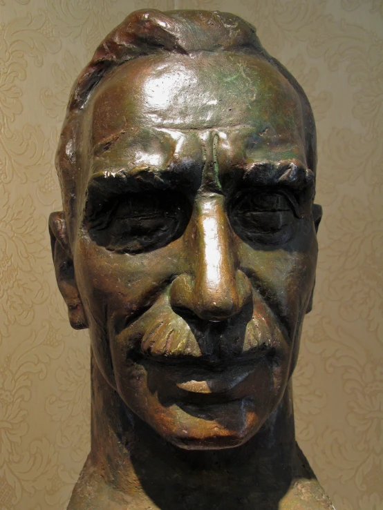 a bronze statue of a man that is very old