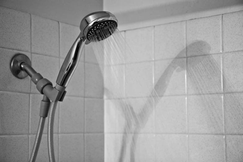 a shower head with water coming from it