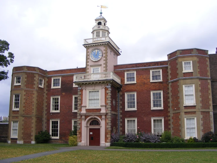 a clock is shown on the top of this building