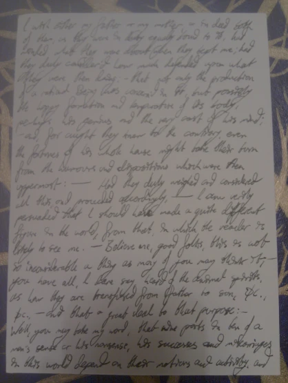 an old handwritten letter with two fingers