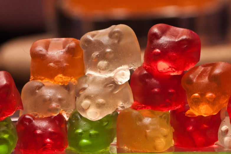 a group of gummy bears sitting next to each other