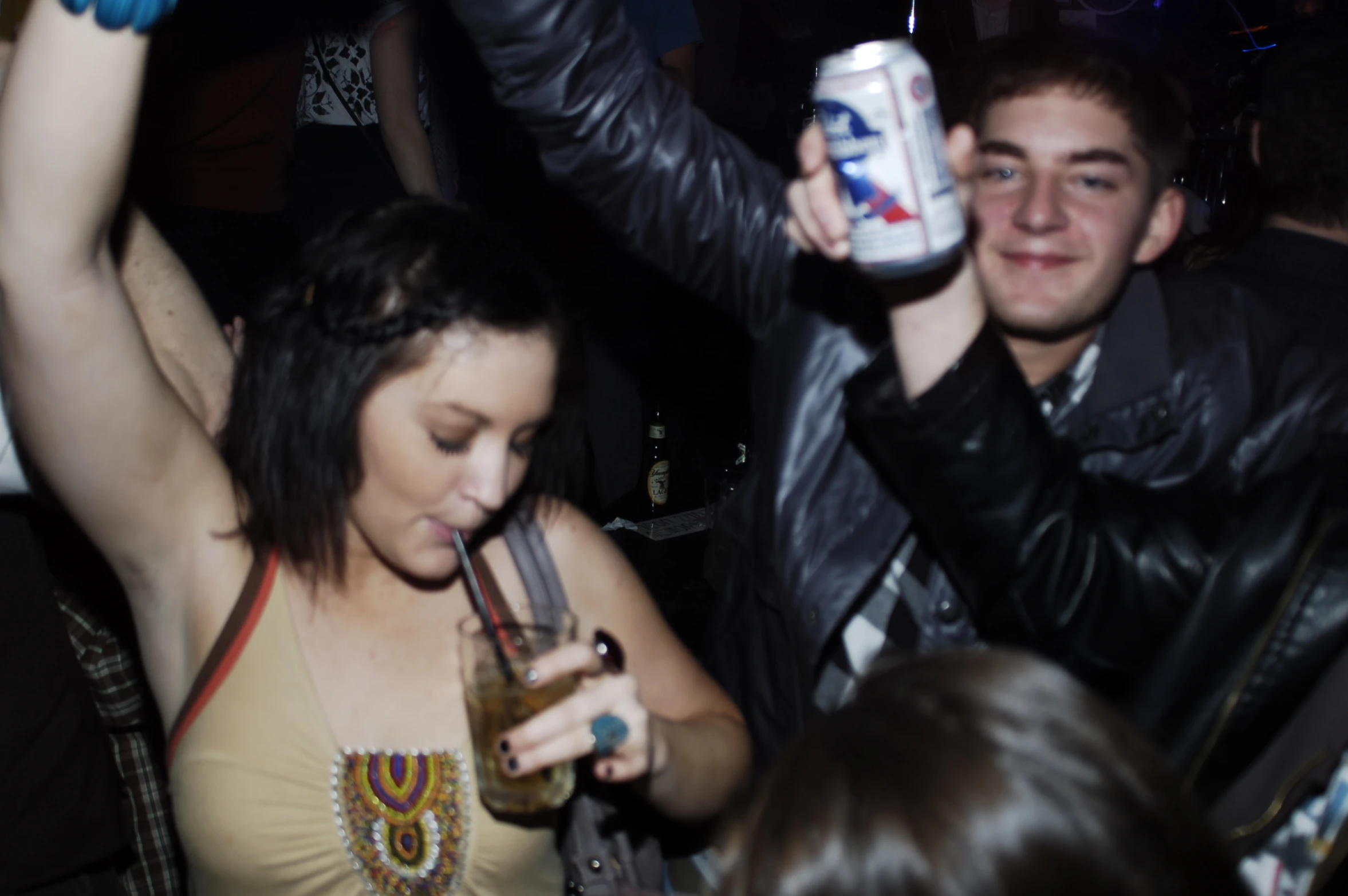 people are at a party holding a beer