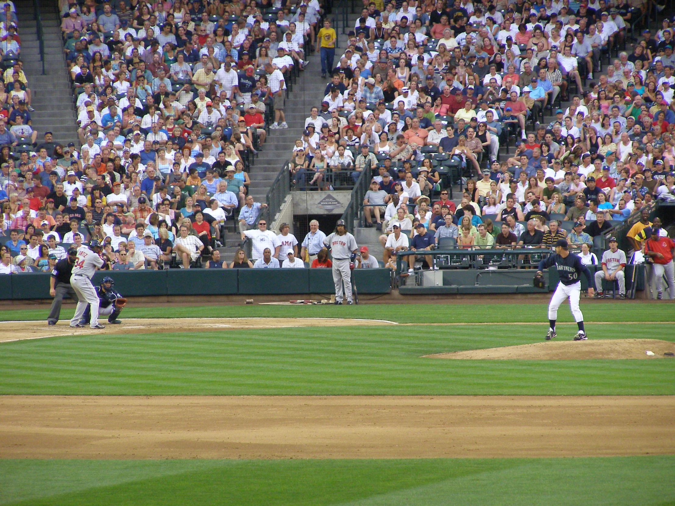 a pitcher throws a ball to a batter