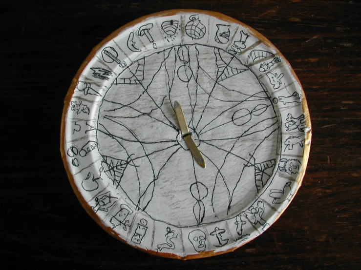 a large clock made of paper with many letters