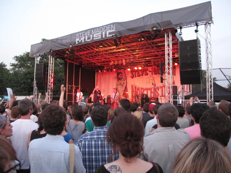 group of people in front of stage performing