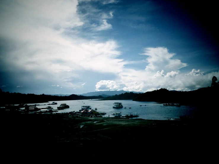 a body of water with some boats floating around