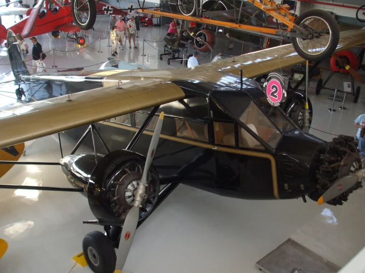an old time biplane is on display at the museum