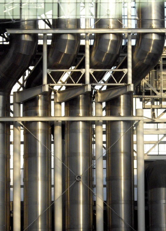 large metal pipes and pipes with windows in the background