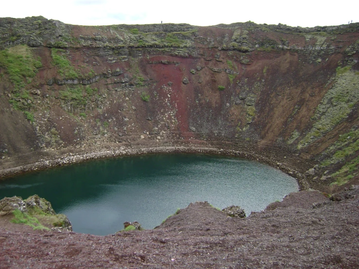 a large pool sitting between two cliffs of water