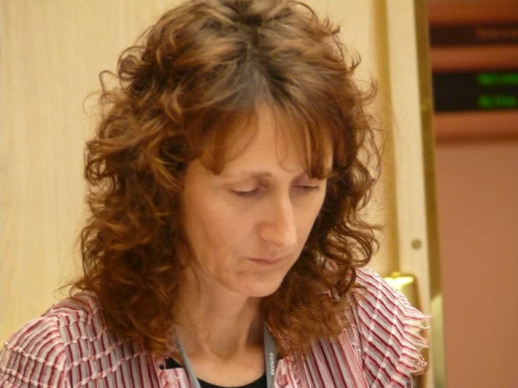 a close up of a woman wearing an ear ring