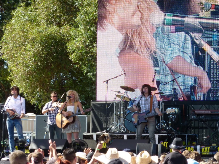 a crowd watching two women performing on stage