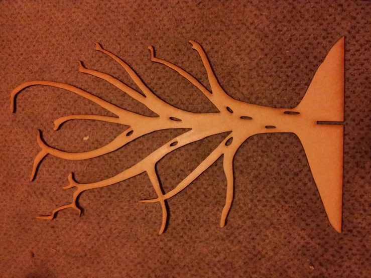 the scissors are cut in to shape of a tree