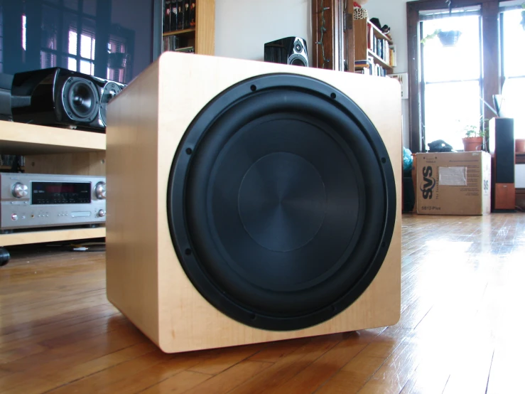 wooden subwoofer sitting in a very nice house