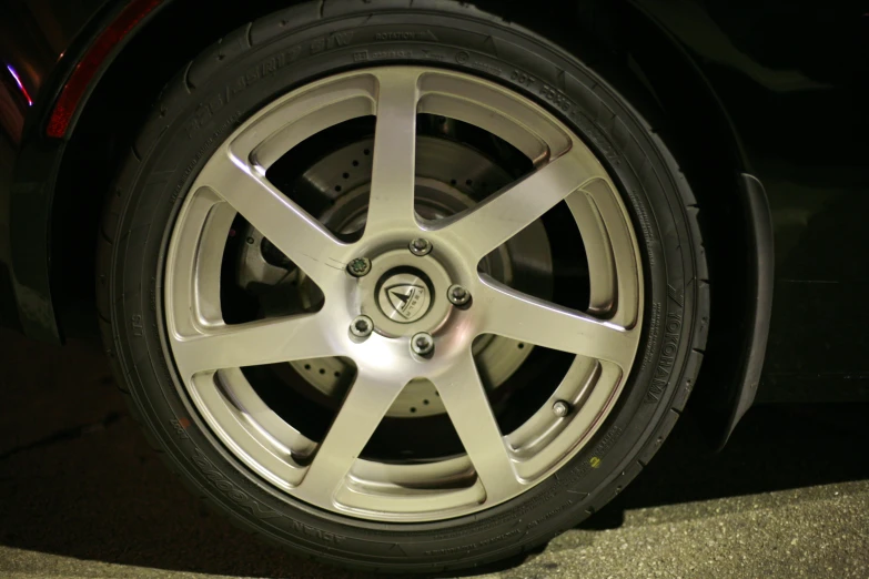 a close up of the spokes of a car