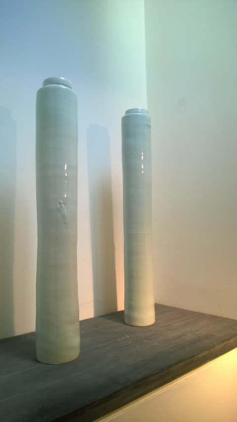 three large ceramic vases and one small ceramic vase