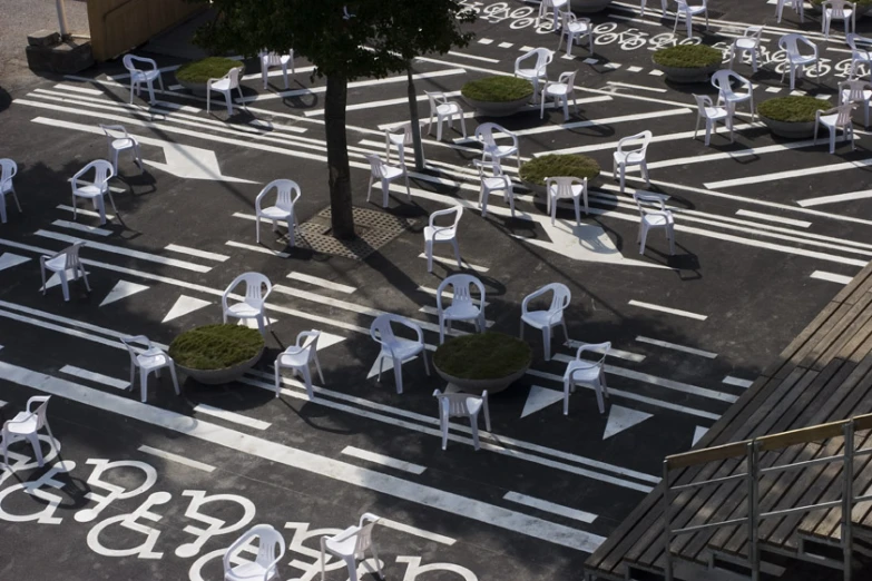 many chairs and tables that have names painted on them