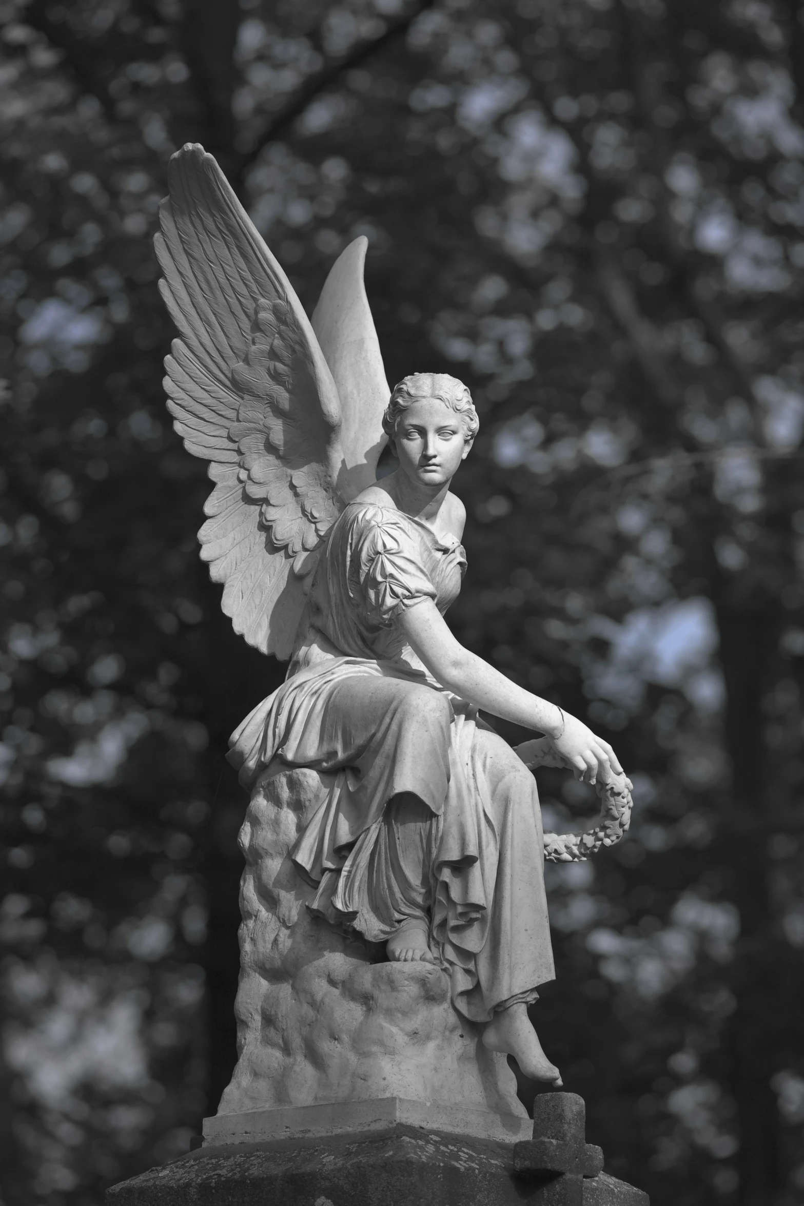 a black and white po of an angel statue