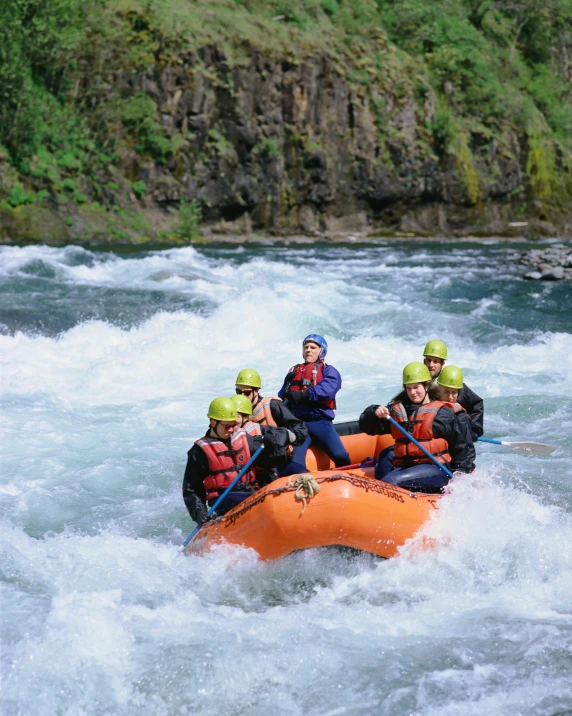 a group of people on rafts in the water