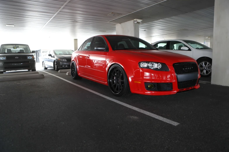 a car parked inside of a white car garage