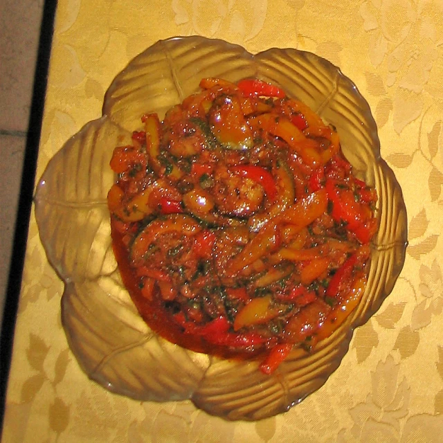 a large bowl is filled with tomatoes and onions