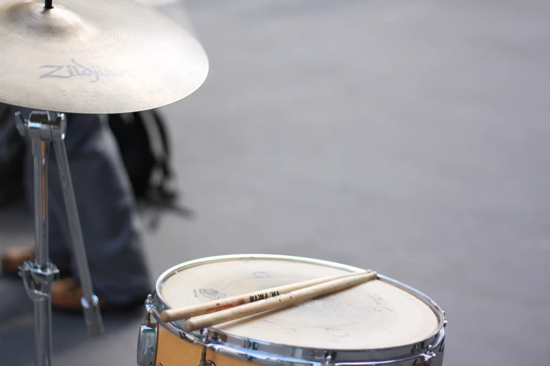 a drummer and a congentyle are sitting in front of a drum