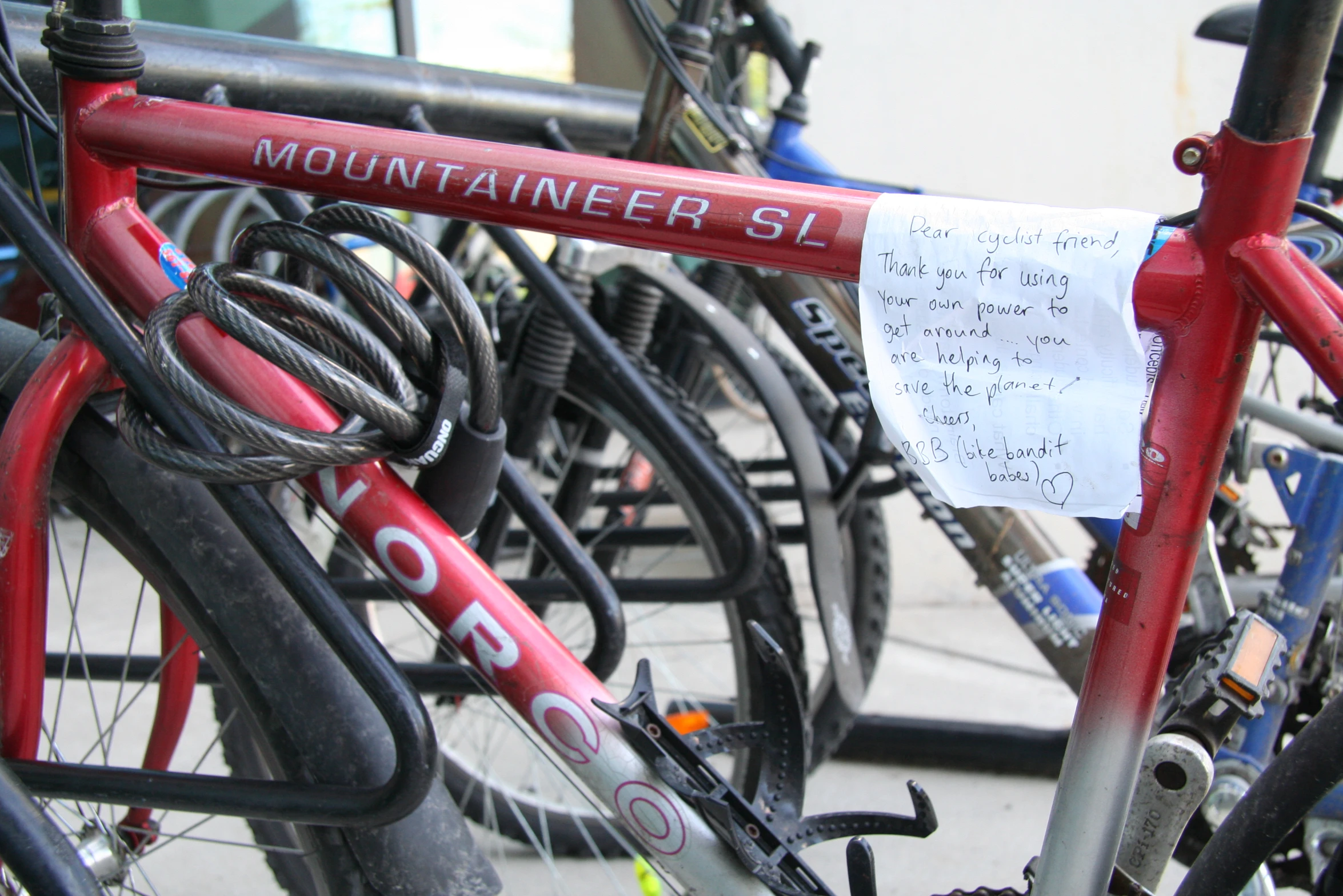 a row of mountaineer bicycles parked next to each other