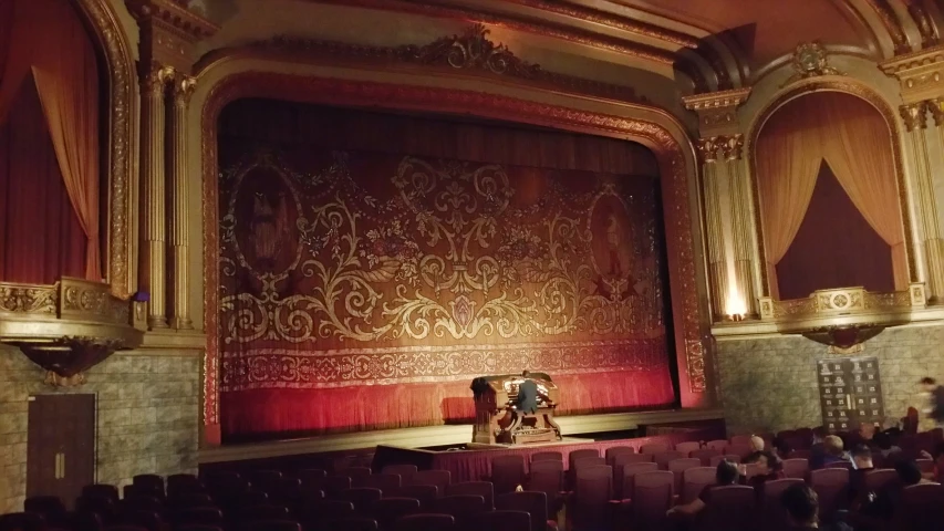 a large stage with two rows of chairs