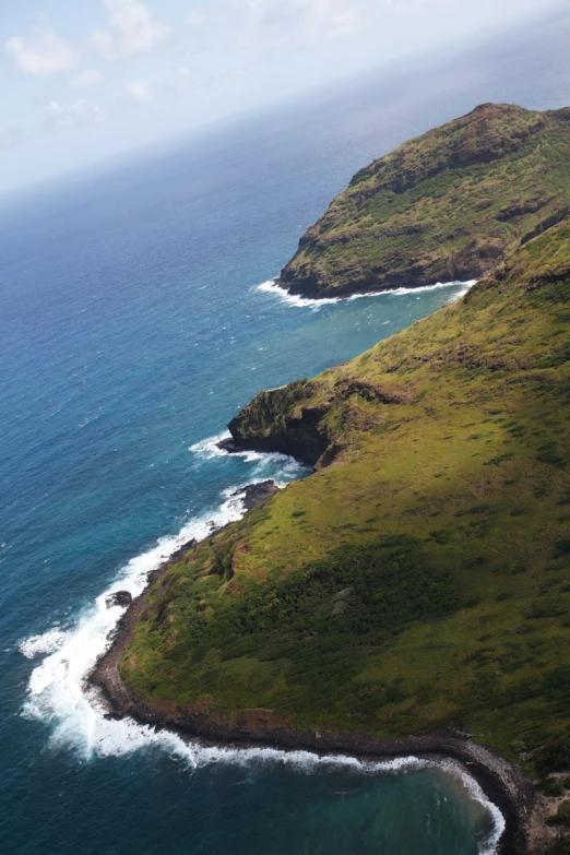 an island that has some grass on the side of it