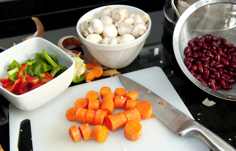 there are vegetables and seasonings on the table