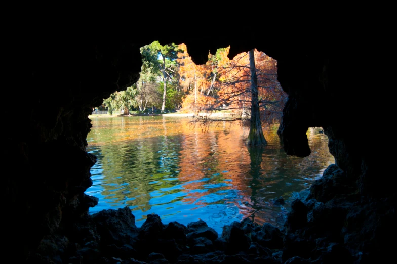 a lake with some trees reflected in the water