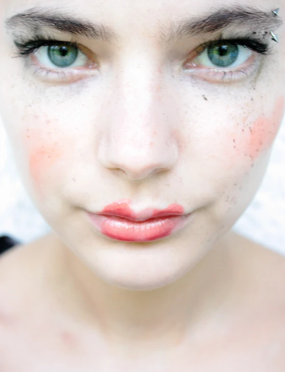 a young woman with painted on her face