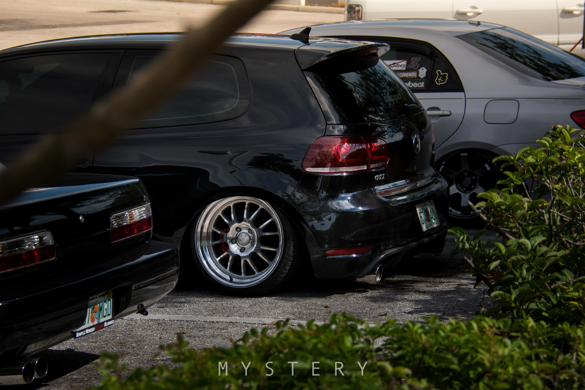 a few cars parked on the side of the road