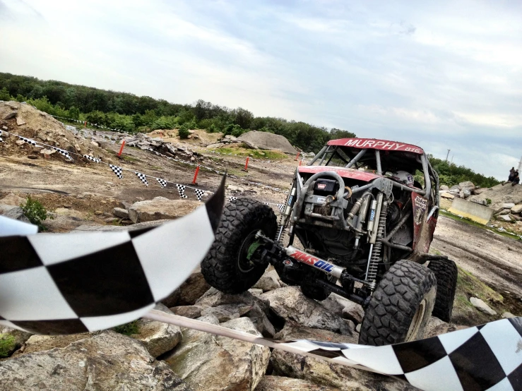 a car that is on top of a rock