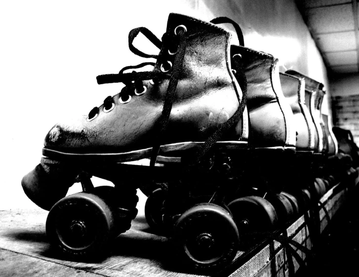 an old pair of roller skates in black and white