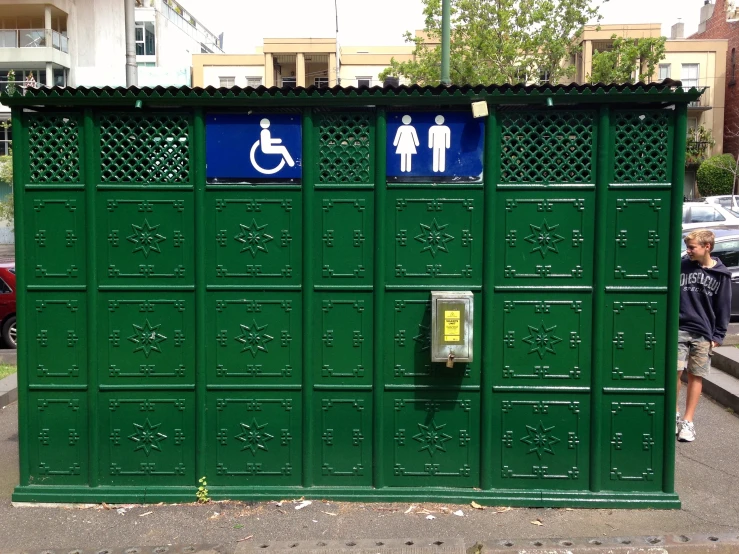 a bathroom stall with a handicap accessible sign on it