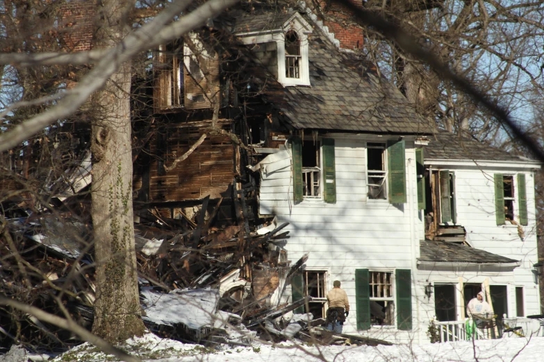 a run down house in the middle of the winter