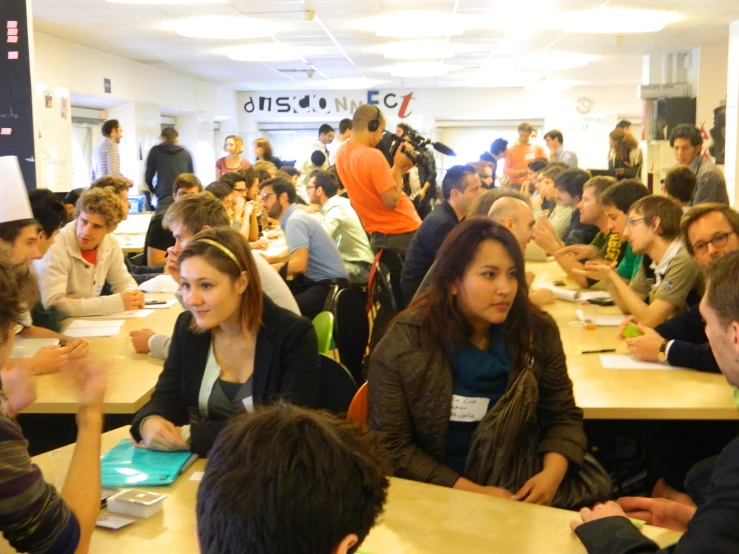 a group of people are gathered around some food