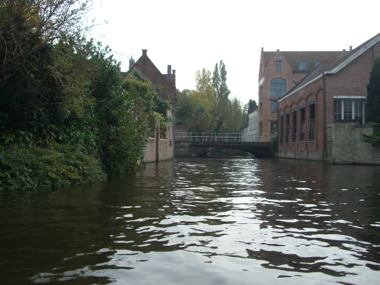 a body of water surrounded by old houses